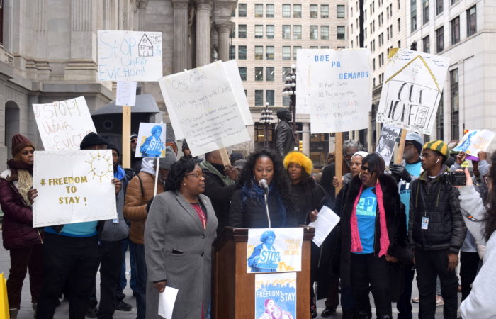 One Pennsylvania at a press conference on the south side of City Hall with Councilmember Kendra Brooks. One PA members are holding signs calling for rent control, an end to unfair evictions and the "freedom to stay".